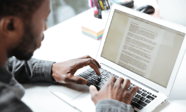 A professional working on a translated CV, ensuring precise and reliable curriculum vitae translations for career growth.