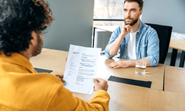 Translator working on a resume, ensuring a career abroad with professional CV translation services in multiple languages.