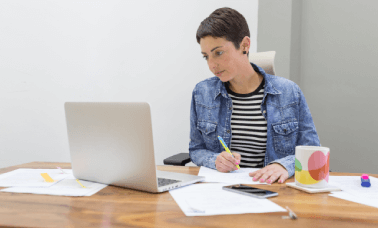 woman reviewing documents, highlighting cost-effective academic translation services for students and professional worldwide.